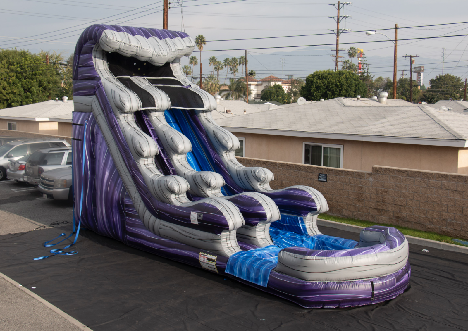 18' foot water slide with pool attached shaded in grey, blue, and midnight purple.